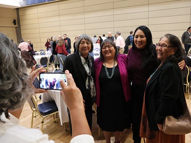 Joan poses for a photo with Indigenous U of A colleagues 