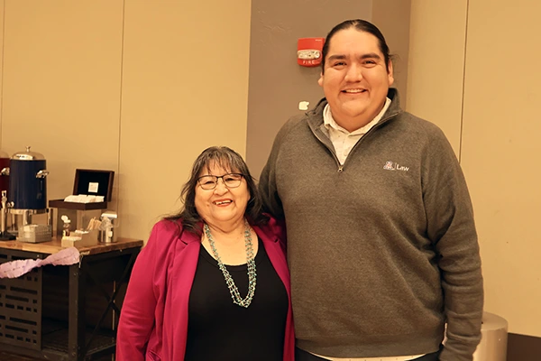 Joan Timeche and Damon Clark pose at Joan's retirement party