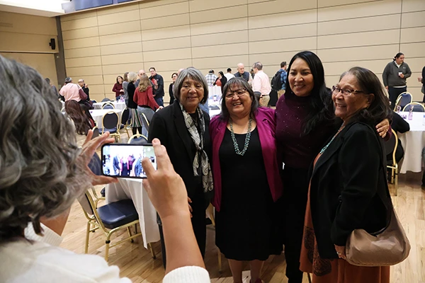 Joan poses for a photo with Indigenous U of A colleagues 
