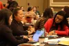 Attendees work as a group during an IDSov Summit session.